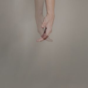 persons hand with pink manicure